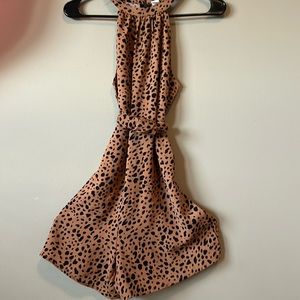 Leopard print romper with zipper back and a tie and untie string